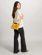 Vali Crossbody Small Golden And Black Leather Bag - Eyes Applique Adjustable Handle